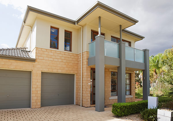 beautifully painted and decorated house exterior with landscaped garden