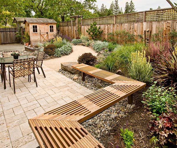 fenced hard landscaped garden with decorative brickwork