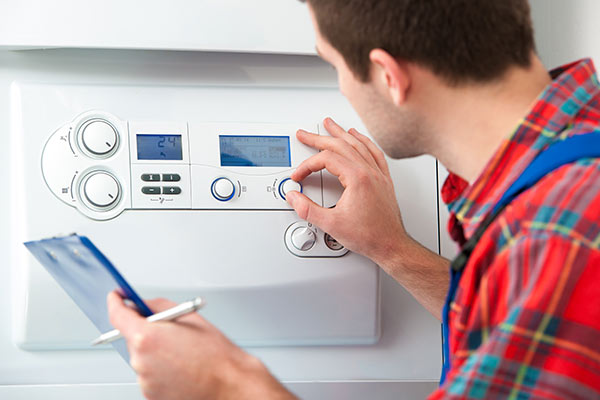 installing-gas-boiler-birmingham AK Construction installing a new boiler in Birmingham
